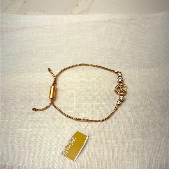 Michael Kors Jewelry - NWT Michael Kors Love is in the air adjustable bracelet.